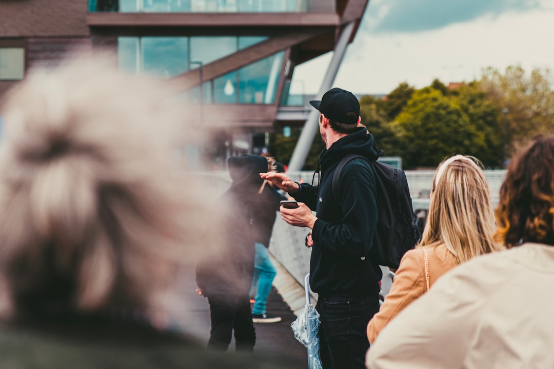 people-standing-near-building-r0zfrpc5jog